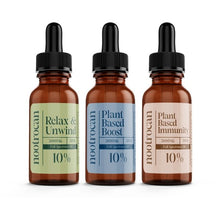 Load image into Gallery viewer, Three amber dropper bottles of Nootrocan 3000mg 10% Full Spectrum CBD Nootropic Oil - 30ml. From left to right, the labels read 'Relax & Unwind,' 'Plant Based Boost,' and 'Plant Based Immunity.' Each bottle contains 20ml of product crafted from organic hemp. The labels are green, blue, and peach, respectively.
