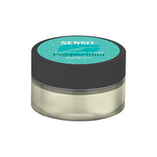 Load image into Gallery viewer, A small, clear plastic jar with a black lid features a teal label adorned with white text. The label reads "Sensi Skin," followed by "Peppermint," "shea infused sugar lip scrub," and "100mg CBD." The vegan-friendly Sensi Skin 100mg CBD Sugar Lip Scrub - 25g (BUY 1 GET 1 FREE) contains a light-colored substance inside.