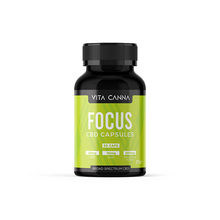 Load image into Gallery viewer, A black bottle of Vitacanna 1000mg Broad Spectrum CBD Vegan Capsules (50 caps) sits against a green background, labeled THC Free with each capsule containing 20mg CBD, 10mg B6, and 200mg Rhodiola.
